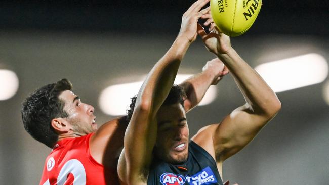 Jake Riccardi, contesting for a mark against Swan Robbie Fox, kicked three goals on Friday night. Picture: Mark Jesser