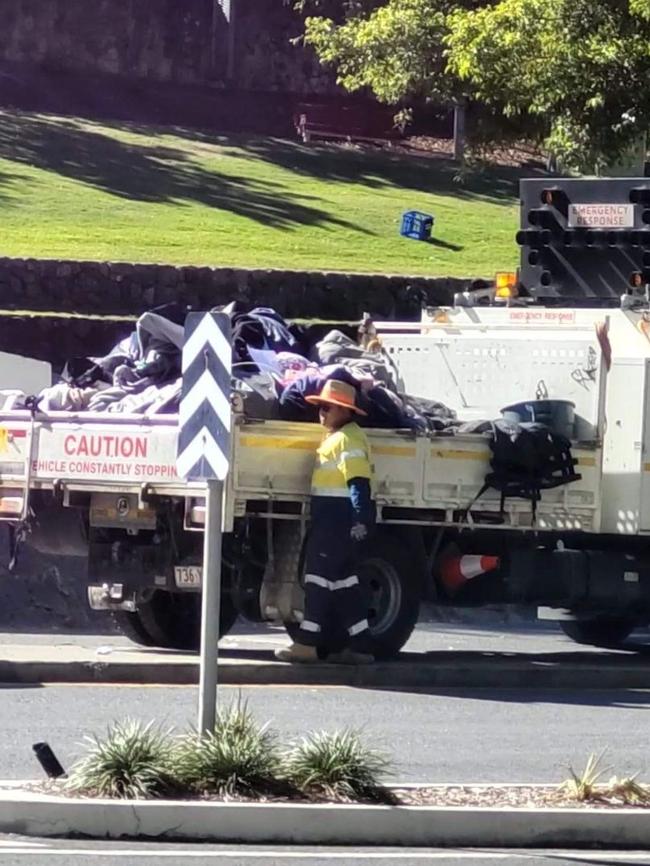 A Brisbane City Council worker pictured removing tents on Roma St. Picture supplied