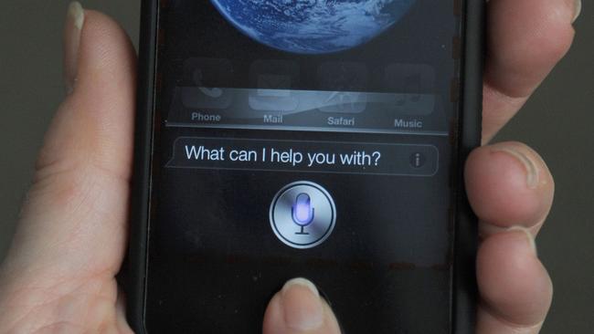 Siri says ... A woman tests out Apple’s personal voice assistant on an iPhone. AFP PHOTO/Karen BLEIER.