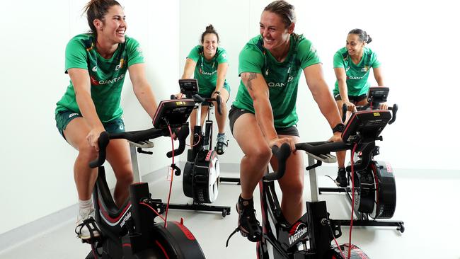 Charlotte Caslick, Shannon Parry, Sharni Williams and Cassie Staples from the Australian Womens Rugby Team, training on stationary bikes in a heat chamber to get ready for the humidity of Tokyo. Picture: Tim Hunter.