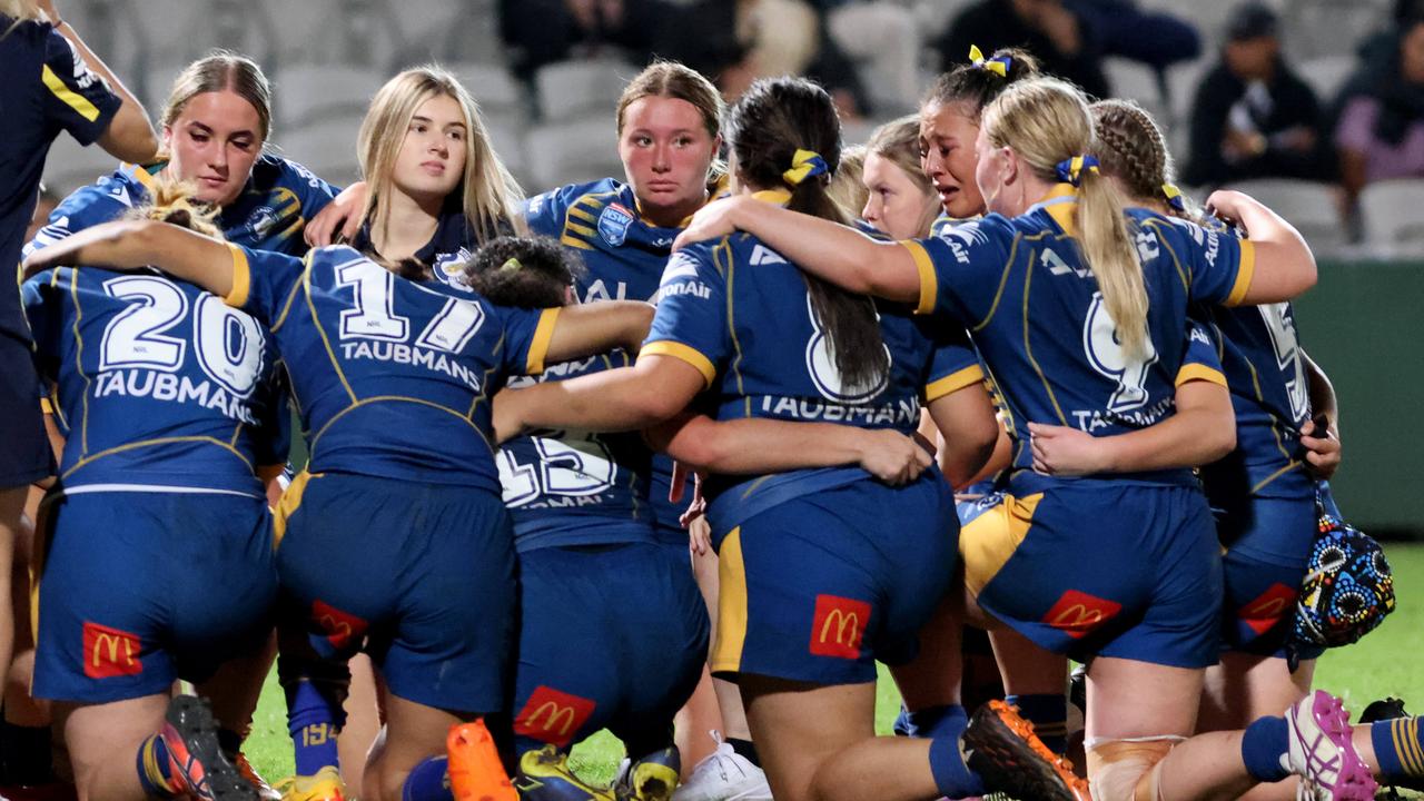 A dejected Parramatta team at the end of the game.