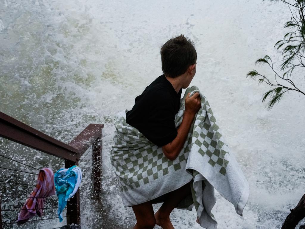 A boy evades a incoming wave at Tweed Heads ahead of Alfred’s arrival. Picture: Getty Images