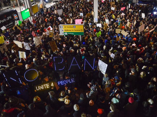 Protesters rally during a demonstration against the Muslim immigration ban at John F. Kennedy International Airport. Picture: Getty