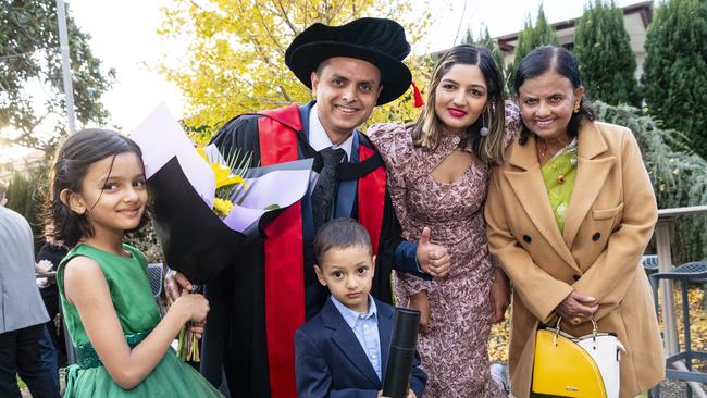 Doctor of Philosophy graduate Avishek Khanal with daughter Avika Khanal, son Amish Khanal, wife Kritika Dhakal and mum Bimala Khanal at a UniSQ graduation ceremony at Empire Theatres, Wednesday, June 28, 2023. Picture: Kevin Farmer