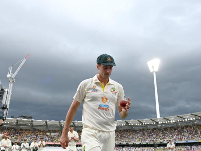 Pat Cummins leaves the Gabba after taking five wickets.