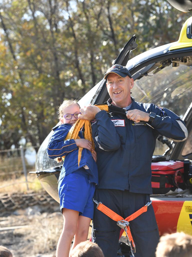 SLSQ Westpac helicopter staff pick up Mount Whitestone State School student Eliza Sutton in a demonstration. PHOTO: ALI KUCHEL