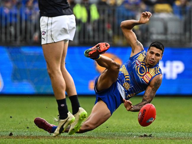 Tim Kelly of the Eagles slips while kicking the ball in 2022. Picture: Daniel Carson/AFL Photos via Getty Images/