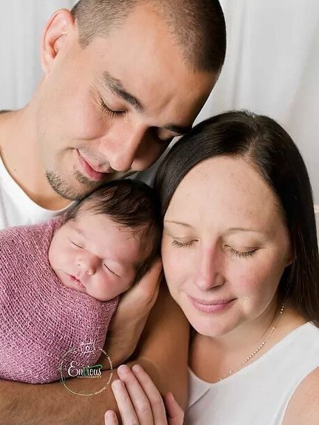 RFS firefighter Andrew O'Dwyer with his wife Melissa and baby Charlotte.