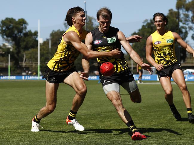 Richmond draft pick Josh Gibcus tackles teammate Kamdyn McIntosh. Picture: Getty Images