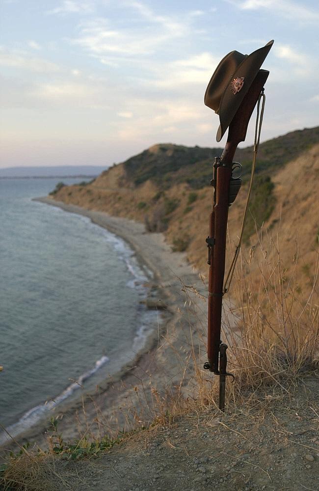 Anzac legend ... A 303 Lee Enfield rifle and slouch hat on the shore at Anzac Cove, Gallipoli, where Australian and New Zealand troops landed.