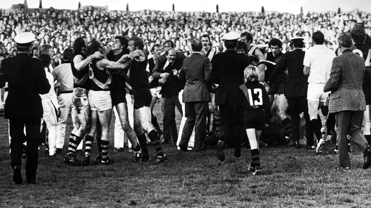 Players, coaches, fans and officials get involved in the infamous 1974 Richmond and Essendon fracas at Windy Hill.