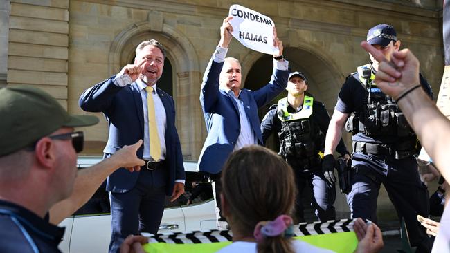 Police stepped in to drag the MPs away. Picture: Dan Peled / NCA NewsWire