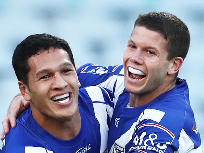 SYDNEY, AUSTRALIA - JUNE 30: Dallin Watene-Zelezniak of the Bulldogs celebrates with team mates after scoring a try during the round 15 NRL match between the Canterbury Bulldogs and the Cronulla Sharks at ANZ Stadium on June 30, 2019 in Sydney, Australia. (Photo by Matt King/Getty Images)