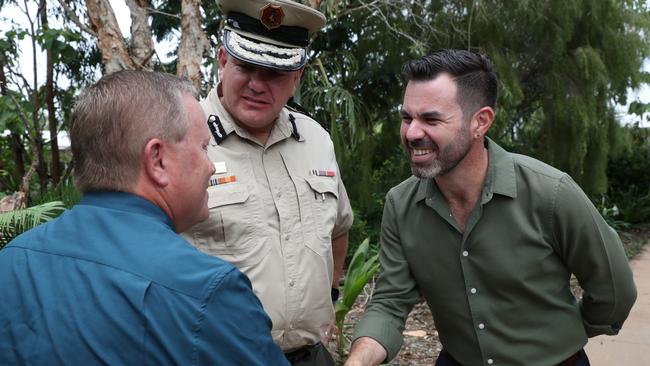 CDU Tafe chief executive Michael Hamilton shakes hands with Attorney-General Chansey Paech with Corrections Commissioner Matthew Varley after the announcement of a $1.7 per-year training partnership between the university and the prisons.