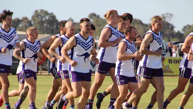 Cohuna Football Netball Club run out on to the field earlier this season. Picture: Cohuna Football Netball Club.