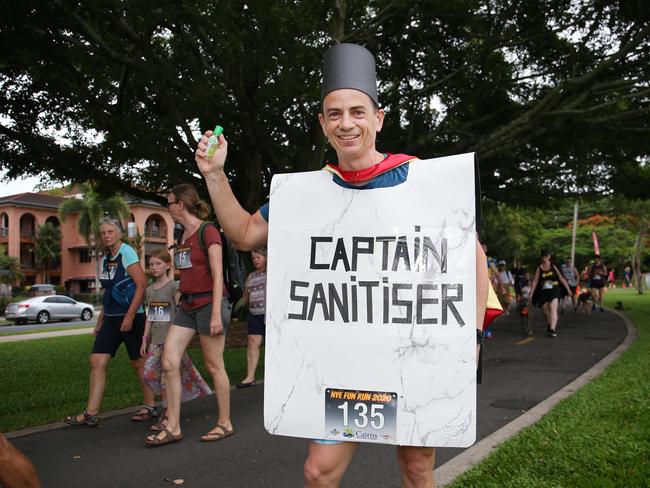 Andrew McLean participated in the Cairns Regional Council's New Year's Eve superhero fun run dressed asa Captain Sanitiser on the Cairns Esplanade. Picture: Brendan Radke