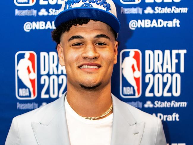 BRISTOL, CT - NOVEMBER 18: Josh Green poses for a photo with his NBA Draft hat after being drafted by the Dallas Mavericks during the 2020 NBA Draft on November 18, 2020. NOTE TO USER: User expressly acknowledges and agrees that, by downloading and/or using this photograph, user is consenting to the terms and conditions of the Getty Images License Agreement. Mandatory Copyright Notice: Copyright 2020 NBAE (Photo by Courtesy of Josh Green/NBAE via Getty Images)