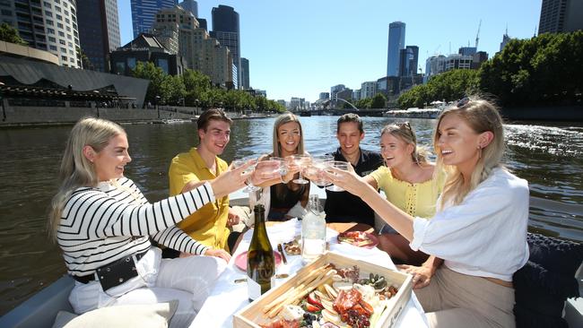 Georgia McGregor, Alex Marucchi, Nina Marucchi, Andrew Ferguson, Maddison Cuthill and Leah Thorpe enjoy a picnic feast on board a GoBoat. Picture: David Caird