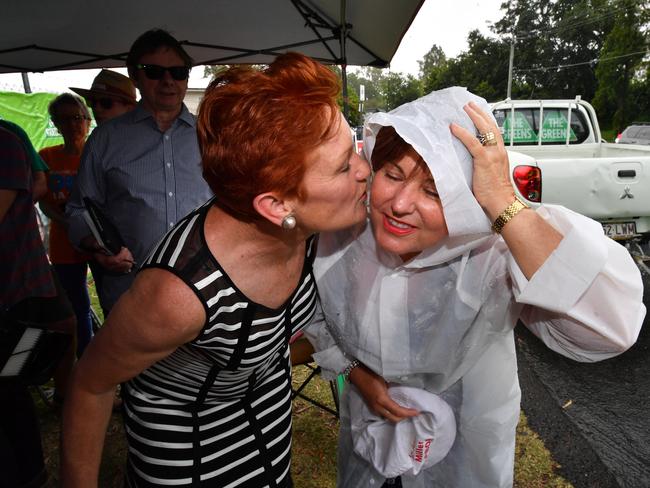 One Nation leader Senator Pauline Hanson gives ALP member for Bundamba Jo-Ann Miller a kiss on the cheek. Picture: AAP Image/Darren England