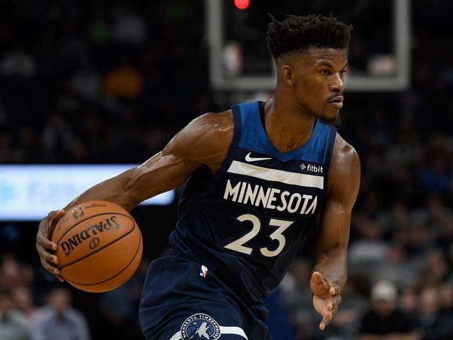 MINNEAPOLIS, MN - OCTOBER 19: Jimmy Butler #23 of the Minnesota Timberwolves dribbles the ball against the Cleveland Cavaliers during the fourth quarter of the game on October 19, 2018 at the Target Center in Minneapolis, Minnesota. The Timberwolves defeated the Cavaliers 131-123. NOTE TO USER: User expressly acknowledges and agrees that, by downloading and or using this Photograph, user is consenting to the terms and conditions of the Getty Images License Agreement.   Hannah Foslien/Getty Images/AFP == FOR NEWSPAPERS, INTERNET, TELCOS & TELEVISION USE ONLY ==