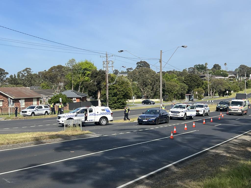 Police at the scene in Endeavour Hills, where a three-year-old girl is believed to have been hit by a car.