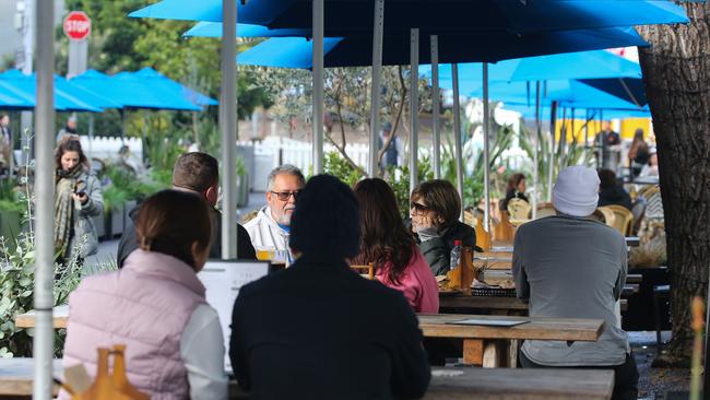 People eating at a cafe in the Sydney CBD. Picture: NCA NewsWire
