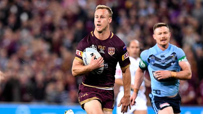 Daly Cherry-Evans races away to score a try for the Maroons.