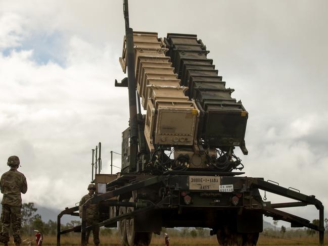 US Army Sgt Tamayo Ezekiel (right) and US Army Private First Class Colby McCormick (left), Army Patriot Launching Station Enhanced Operators, raise the MIM-104 Patriot launching station at Camp Growl during Exercise Talisman Sabre. Picture: Lance Cpl Alyssa Chuluda/US Marine Corps