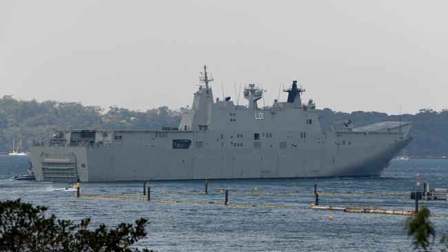 HMAS Adelaide departed Garden Island naval base on Saturday to assist in bushfire-affected areas. Picture: AAP