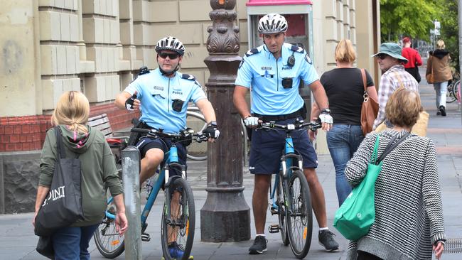 Senior constables Uwe Stolzenberg and Ferdi Cokelek watch pedestrians crossing at the lights. Picture: David Crosling