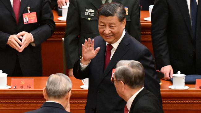 Xi Jinping waves to delegates after the opening session of the 20th Chinese Communist Party's Congress at the Great Hall of the People in Beijing on Sunday. Picture: AFP