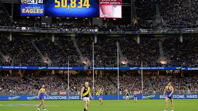 PERTH, AUSTRALIA - JUNE 13: The crowd attendance can be seen during the 2021 AFL Round 13 match between the West Coast Eagles and the Richmond Tigers at Optus Stadium on June 13, 2021 in Perth, Australia. (Photo by Will Russell/AFL Photos via Getty Images)