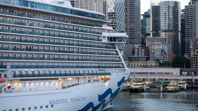 Hundreds of COVID-19 positive travellers are disembarking a cruise ship docked in Sydney this morning, with passengers advised not to catch public transport home. Picture: Julian Andrews.