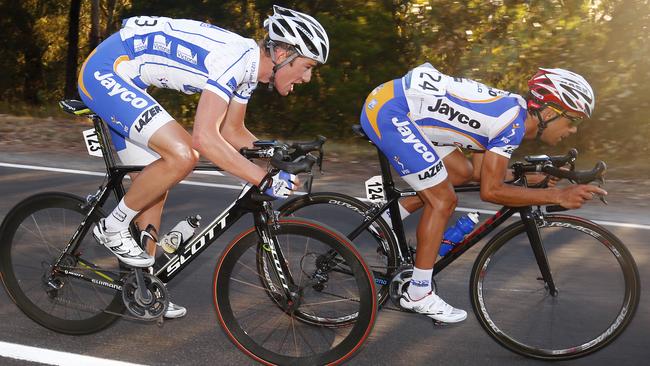 Calvin Watson talks with teammate Lachie Norris during a stage of the Herald Sun tour.