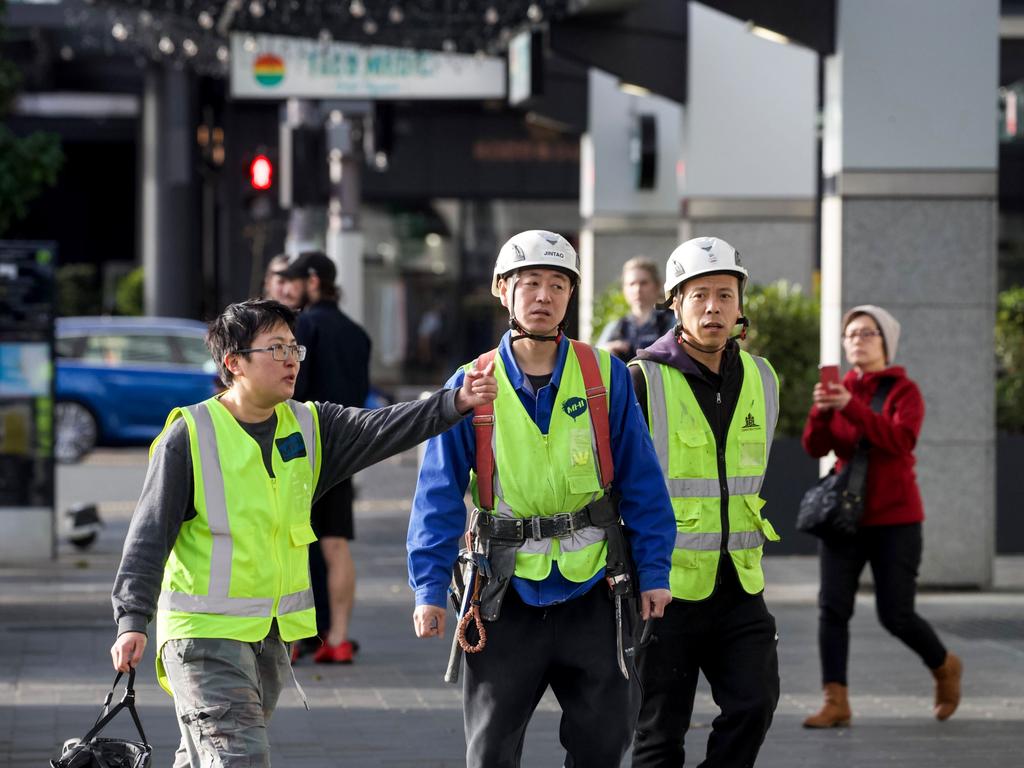 Construction workers near the scene. Picture: Jason Oxenham/NZ Herald