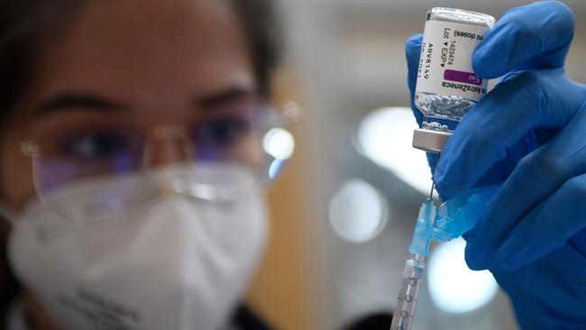 (FILES) In this file photo taken on March 13, 2021 a nurse fills a syringe with the AstraZeneca Covid-19 vaccine during a mass vaccination campaign for people between ages of 50 to 55 in Vigo, northwestern Spain. - Spain said on March 18, 2021 it will resume its Covid-19 inoculation campaign with the AstraZeneca Covid-19 vaccine next week, after the EU's drug regulator deemed the jab "safe and effective". (Photo by MIGUEL RIOPA / AFP)