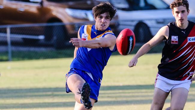 Bailey Stevens gets a kick away for Heathmont. Picture: Chris Mirtschin