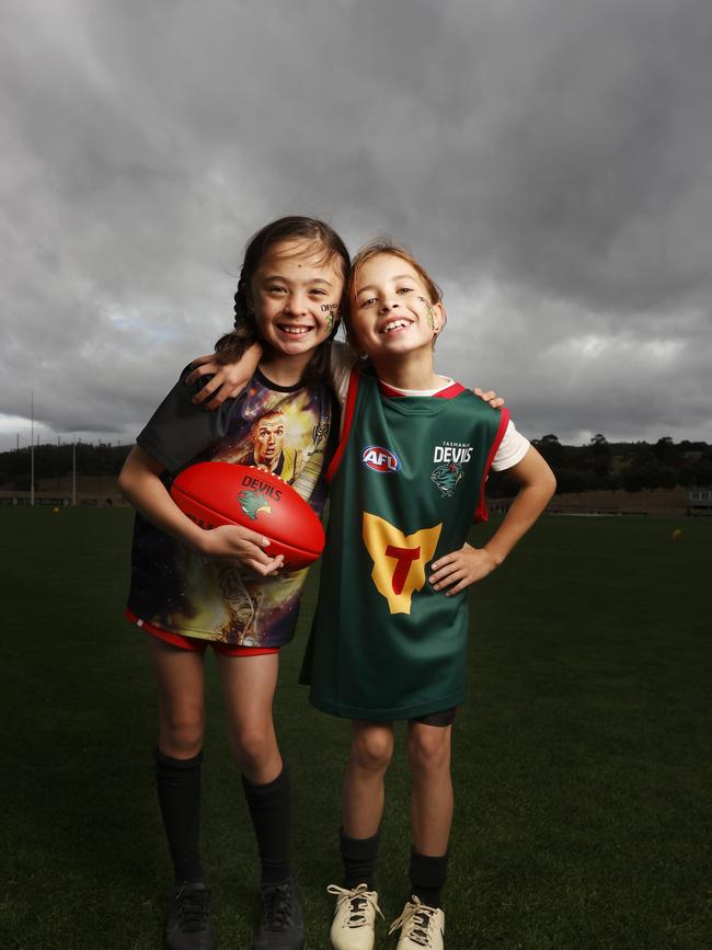 Emma Banks 9 and Ivy Hickey 9 who play for Clarence Junior Football Club. Tasmanian kids from across the state have been able to get in the Devils spirit at the Tasmania Football Club school holiday clinics. Picture: Nikki Davis-Jones