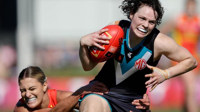 Port Adelaide’s Ebony O'Dea is tackled by a desperate Lauren Bella. Picture: Russell Freeman/AFL Photos via Getty Images