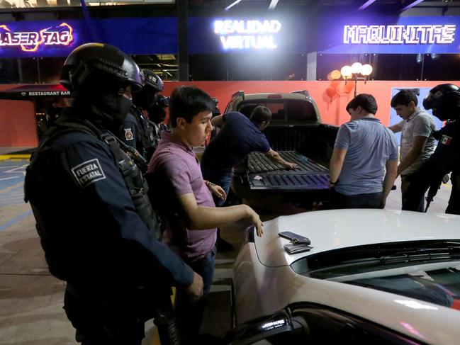 The Sinaloa State Police Elite Prevention Squad patrol the streets of Culiacan in the fight against drugs. Picture Nathan Edwards