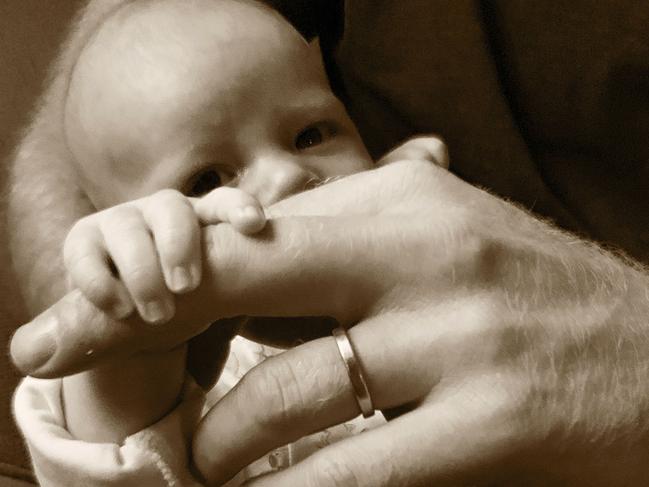 In this undated photo issued by Britain's Prince Harry Duke and Duchess of Sussex of their six-week-old son Archie Harrison Mountbatten-Windsor that they shared on their Instagram account @SussexRoyal to mark Father's Day, Sunday June 16, 2019.  Prince Harry and Meghan Duchess of Sussex are celebrating their first Father's Day together with their son Archie, by sharing this new sepia toned image showing Prince Harry holding Archie, on their royal Instagram account. (The Duke and Duchess of Sussex/@SussexRoyal via AP) MUST BE USED WITH ORIGINAL TONING AS ISSUED - NO SALES - NO COMMERCIAL USE