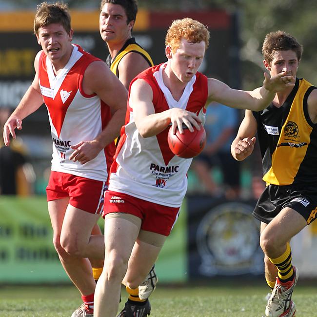 Josh Green kicks bursts clear for Clarence against Hobart in 2010.