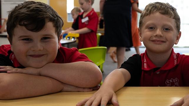 A couple of Gympie West State School students play at the store together on their first day of prep.