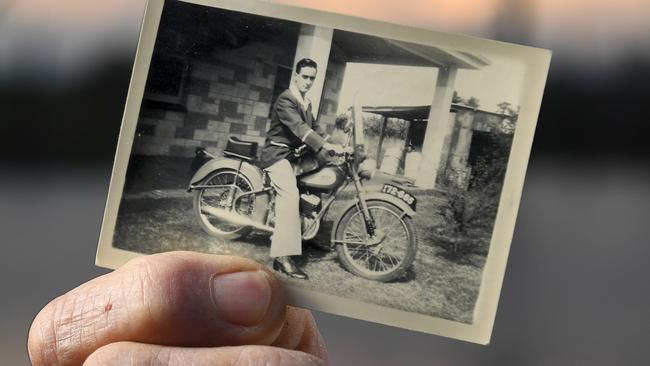 Colin Roy, with a photo of his BSA Bantam motorbike. Photo Naomi Jellicoe