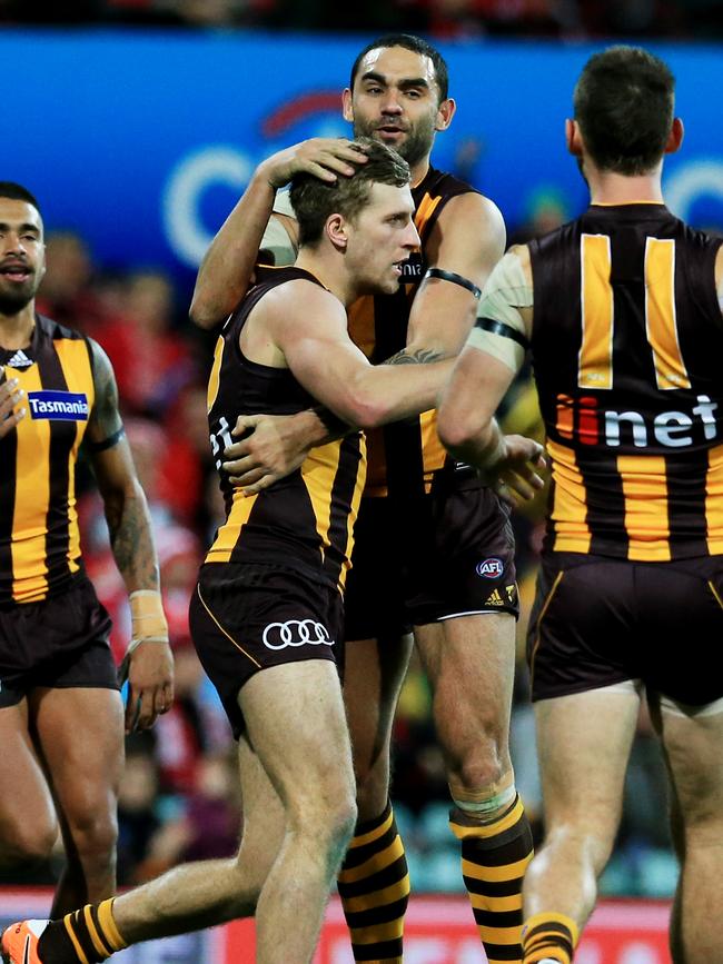 Jonathan O'Rourke is embraced by Hawthorn teammate Shaun Burgoyne. Picture: Mark Evans