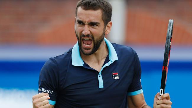Croatia's Marin Cilic celebrates beating Luxembourg's Gilles Muller.