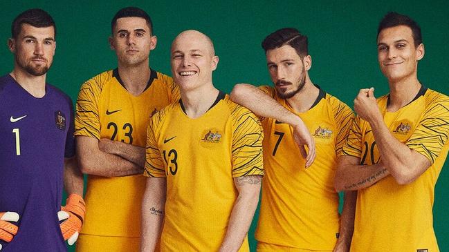 Socceroos players (l-r) Mat Ryan, Tom Rogic, Aaron Mooy, Mathew Leckie and Trent Sainsbury model the new home kit for the World Cup.