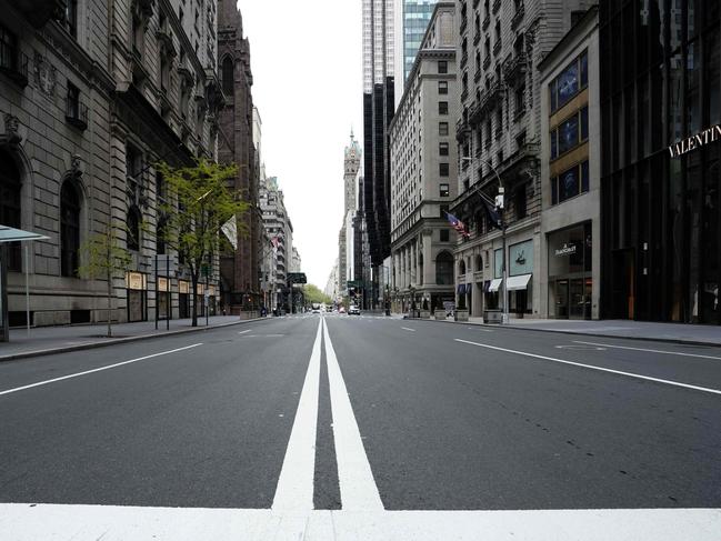 Once the bustling retail artery of New York City, Fifth Avenue is now deserted as the shopping sector hits record low, impacting markets. Picture: AFP