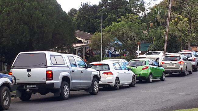 Cars lined up around the block from the drive through testing clinic operating out of the old Bellorana Hostel site in Bellingen. Photo by Janine Watson