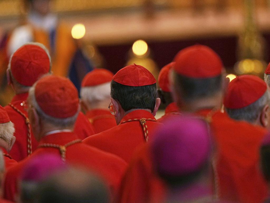 Cardinals stand by the body of Pope Francis after it arrived in St. Peter's Basilica. Picture: AP